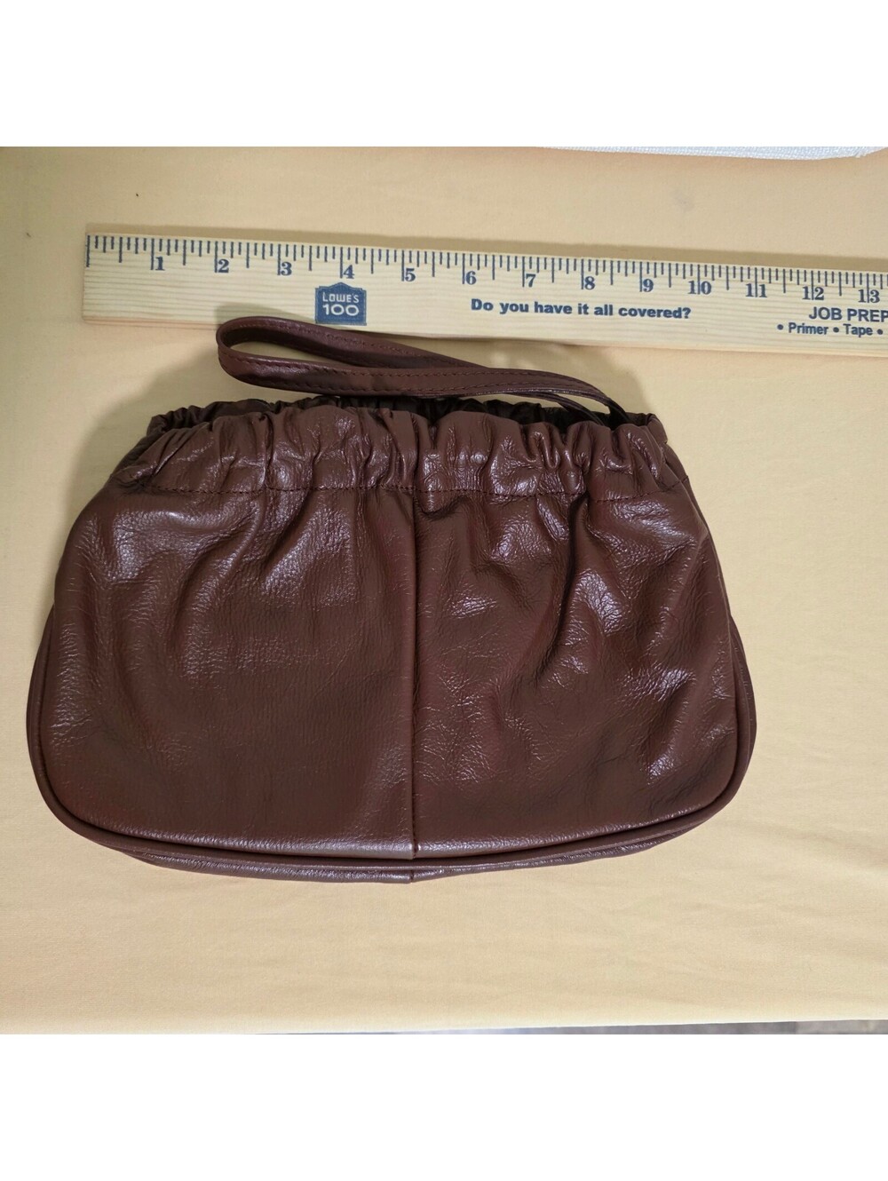 vintage brown leather pouch-style wristlet clutch